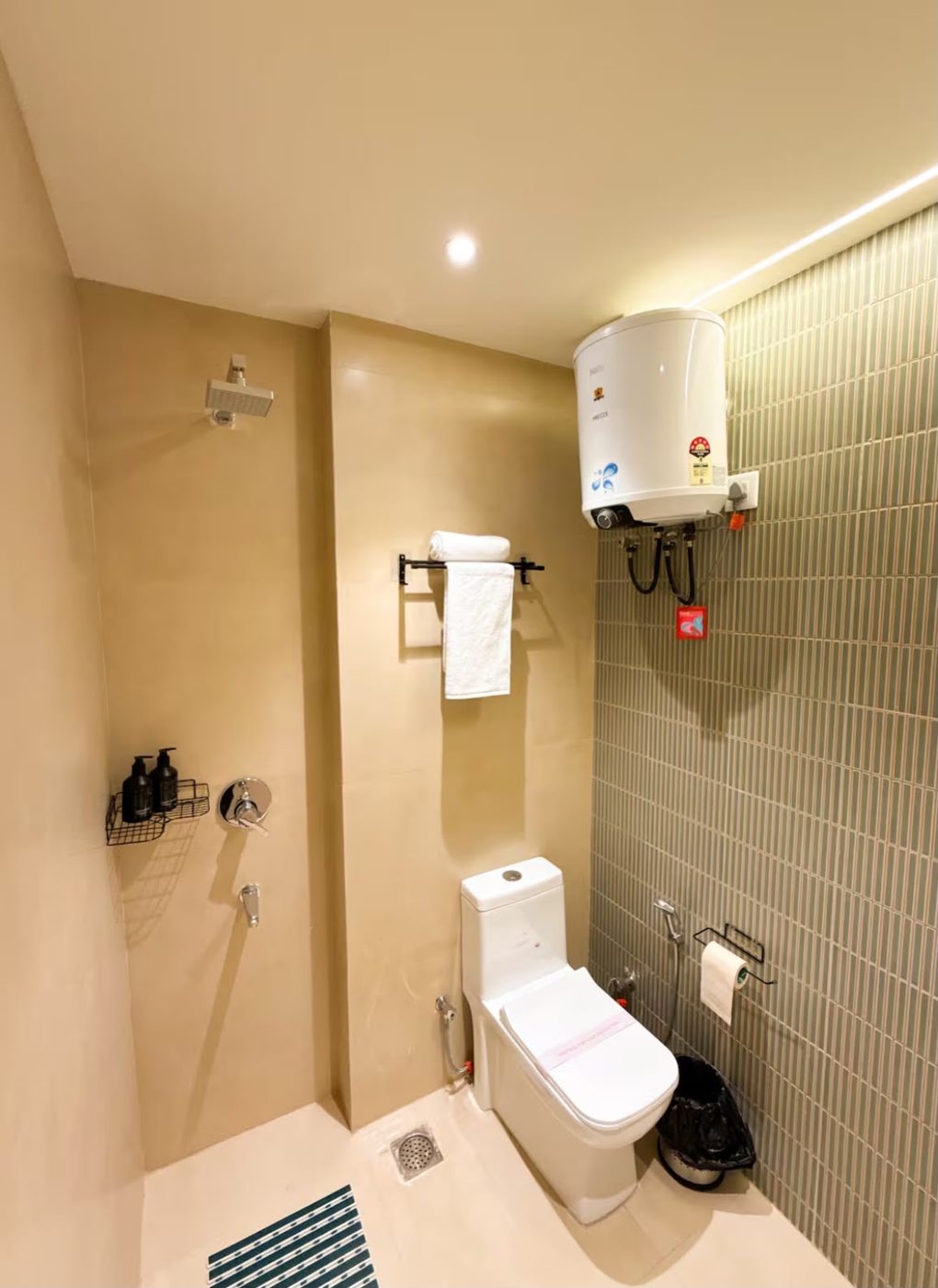 Bathroom with walk-in shower and green tiles
