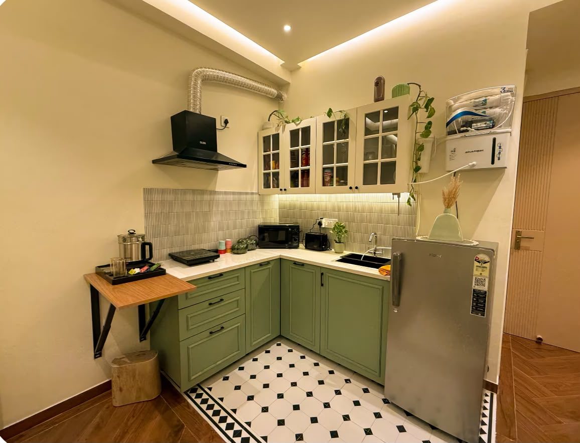 Green shaker-style modular kitchen